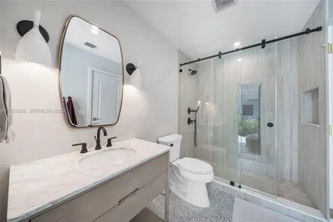 a bathroom with a sink double vanity and a mirror