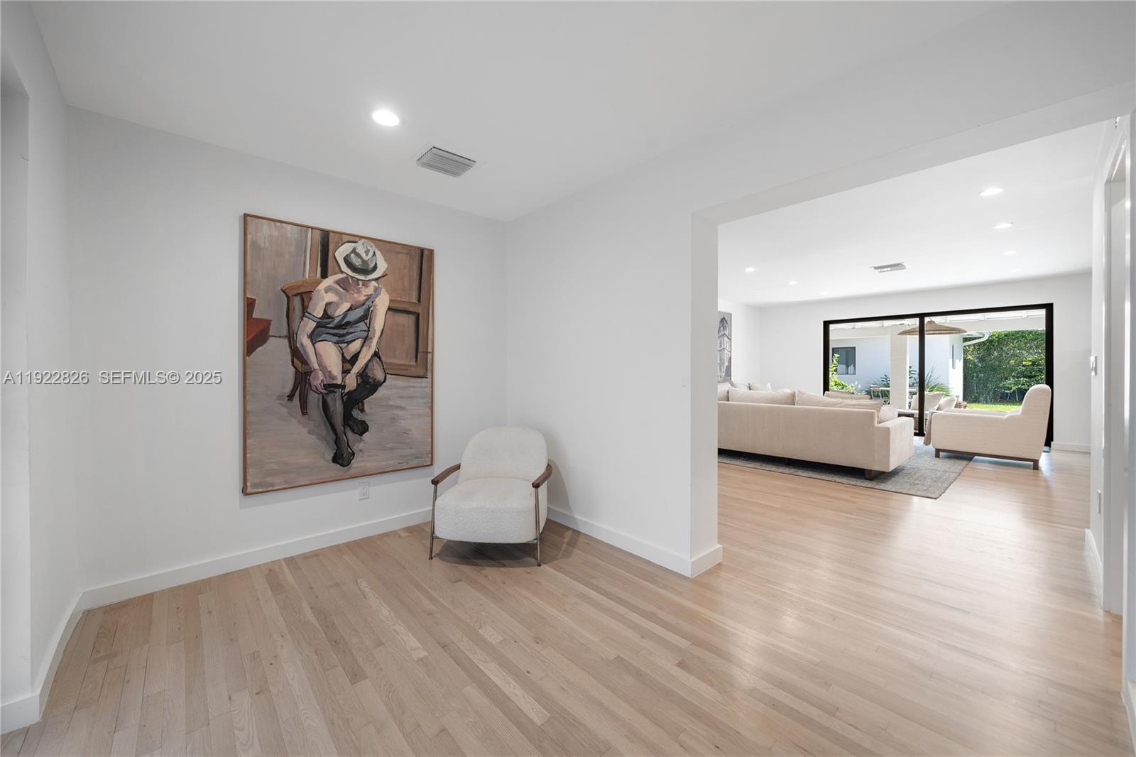 7220 Southwest 107th Terrace Pinecrest, FL 33156 - Photo 2 of 24 a living room with furniture and a wooden floor