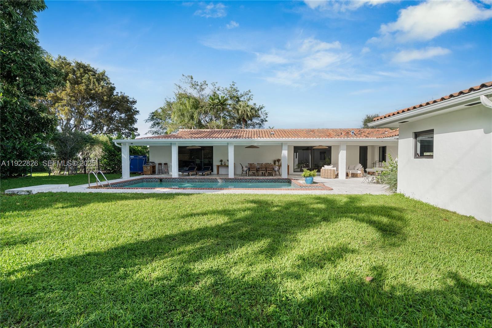 7220 Southwest 107th Terrace Pinecrest, FL 33156 - Photo 23 of 24 a view of house that has a yard