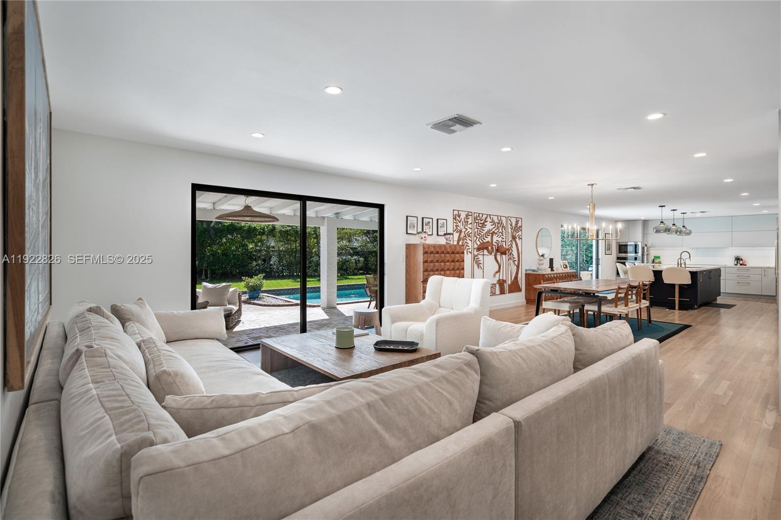 7220 Southwest 107th Terrace Pinecrest, FL 33156 - Photo 3 of 24 a living room with furniture and a large window