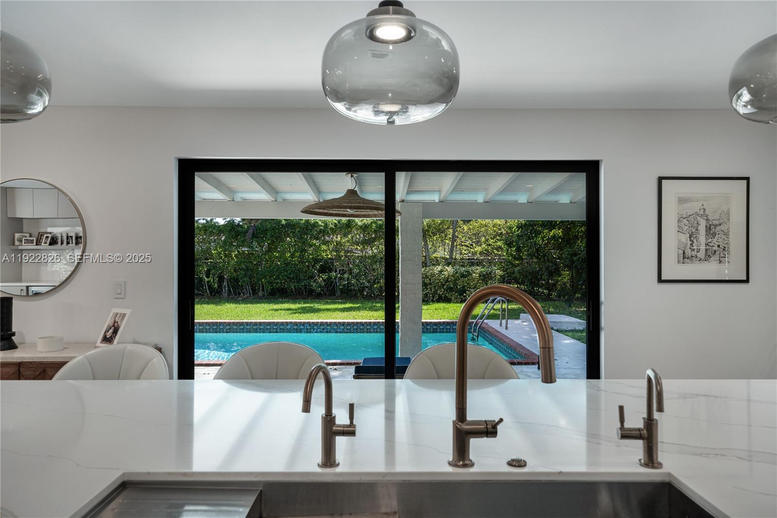 7220 Southwest 107th Terrace Pinecrest, FL 33156 - Photo 7 of 24 a living room with furniture and a large window