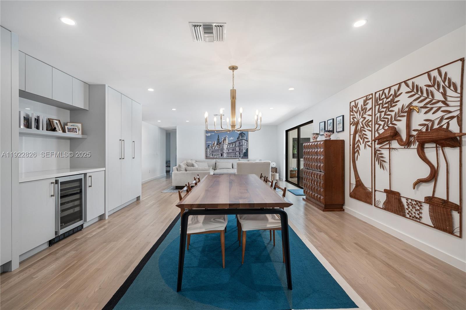 7220 Southwest 107th Terrace Pinecrest, FL 33156 - Photo 8 of 24 a dining room with furniture and wooden floor