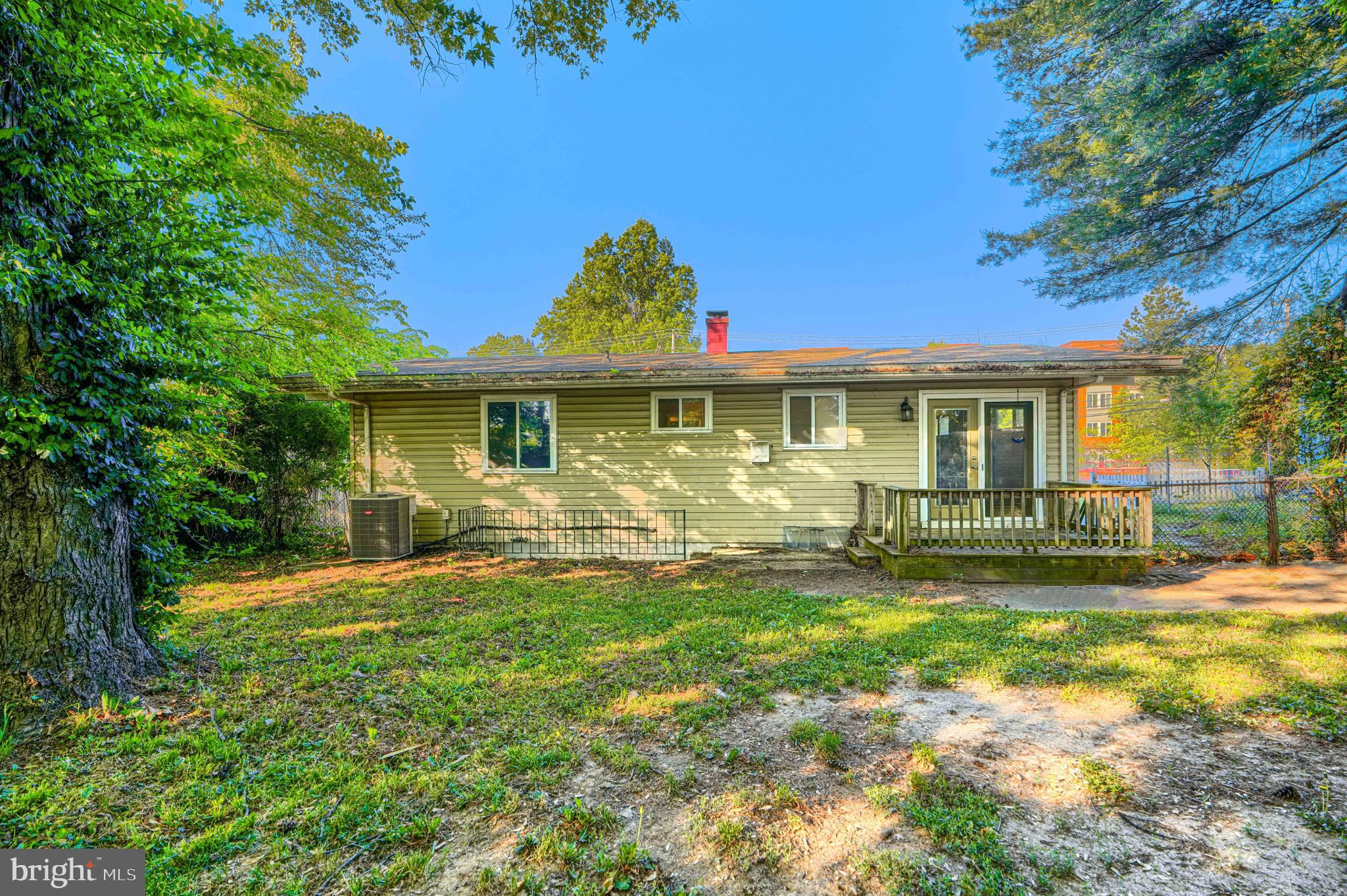 9706 Liberty Road Randallstown, MD 21133 - Photo 6 of 43 a front view of a house with a yard