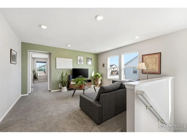 a bathroom with a sink mirror and toilet