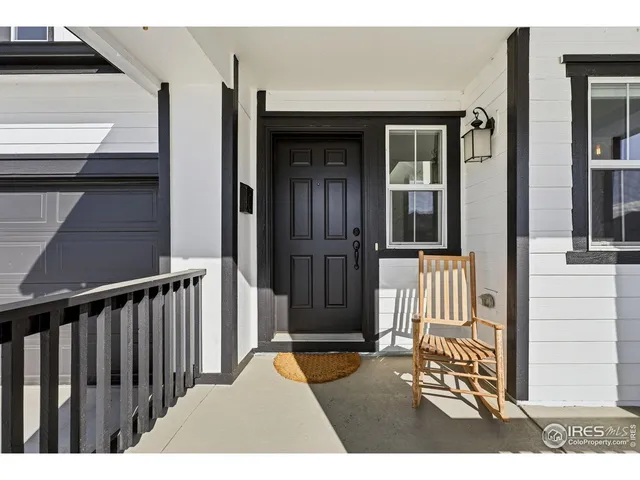 a view of a house with a door and wooden floor