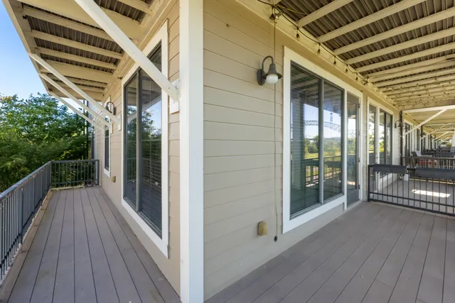a balcony with wooden floor