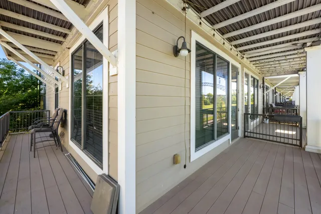 a view of a balcony with wooden floor
