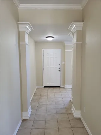 a view of a hallway to rooms