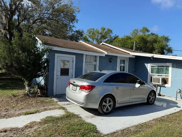 a car parked in front of a house