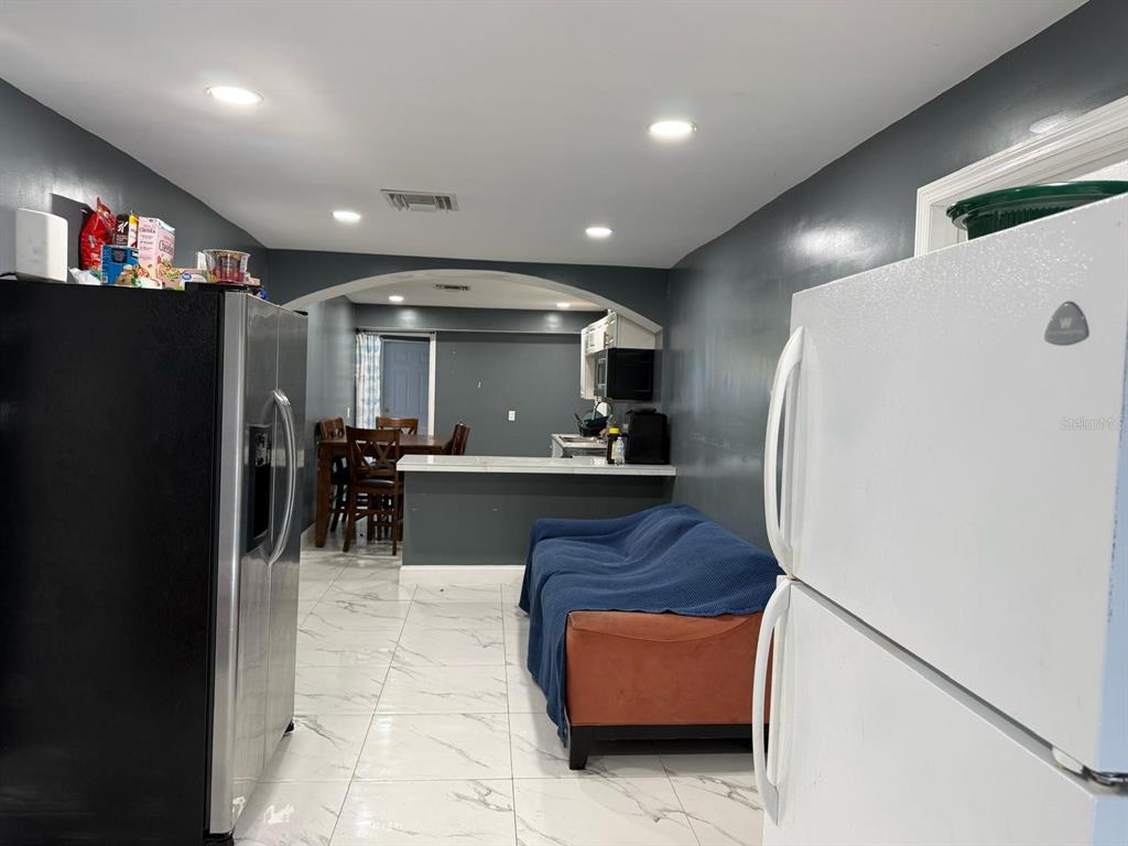 414 Spring Avenue Arcadia, FL 34266 - Photo 19 of 36 a view of kitchen with furniture and a refrigerator