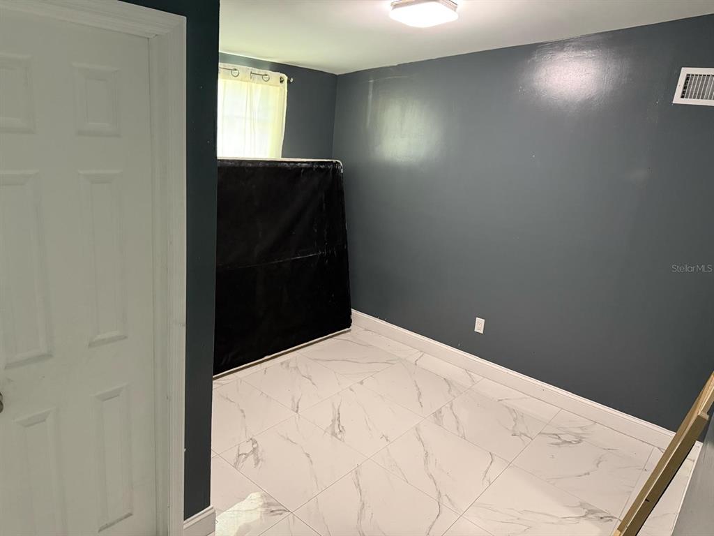 414 Spring Avenue Arcadia, FL 34266 - Photo 21 of 36 a bathroom with a sink and a mirror