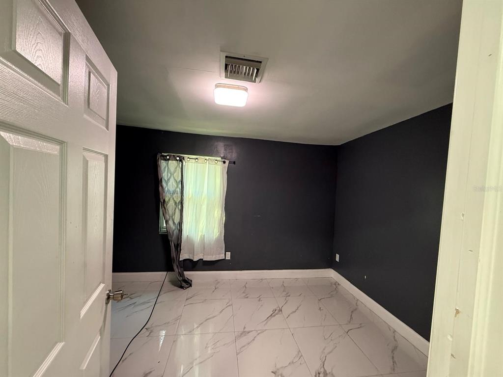 414 Spring Avenue Arcadia, FL 34266 - Photo 24 of 36 a view of an empty room and window