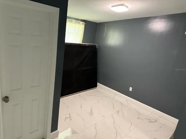a bathroom with a sink vanity and mirror