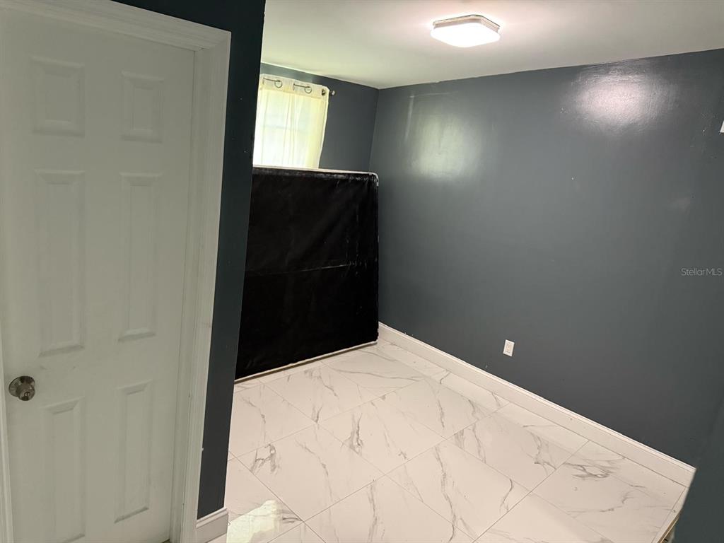 414 Spring Avenue Arcadia, FL 34266 - Photo 26 of 36 a bathroom with a sink vanity and mirror