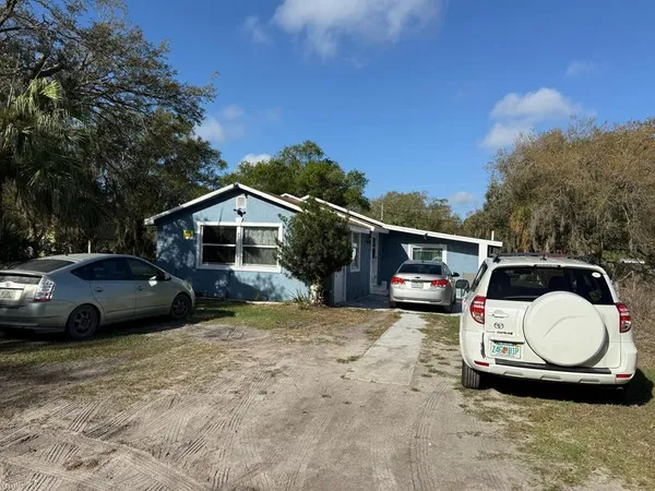 a view of a car parked in front of a house