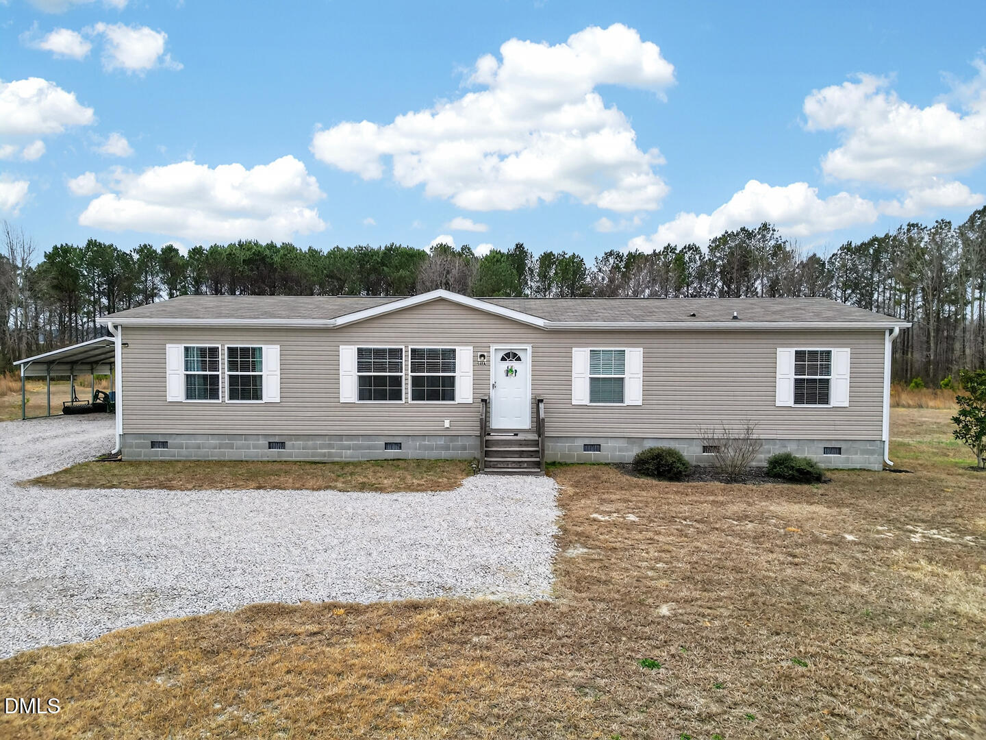 540 Pine Ridge Road Zebulon, NC 27597 - Photo 5 of 96 a front view of house with yard and barbeque oven in front of it