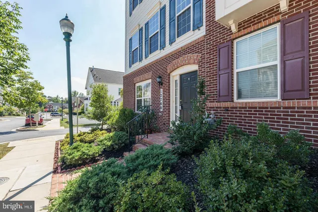 a view of a brick building next to a yard
