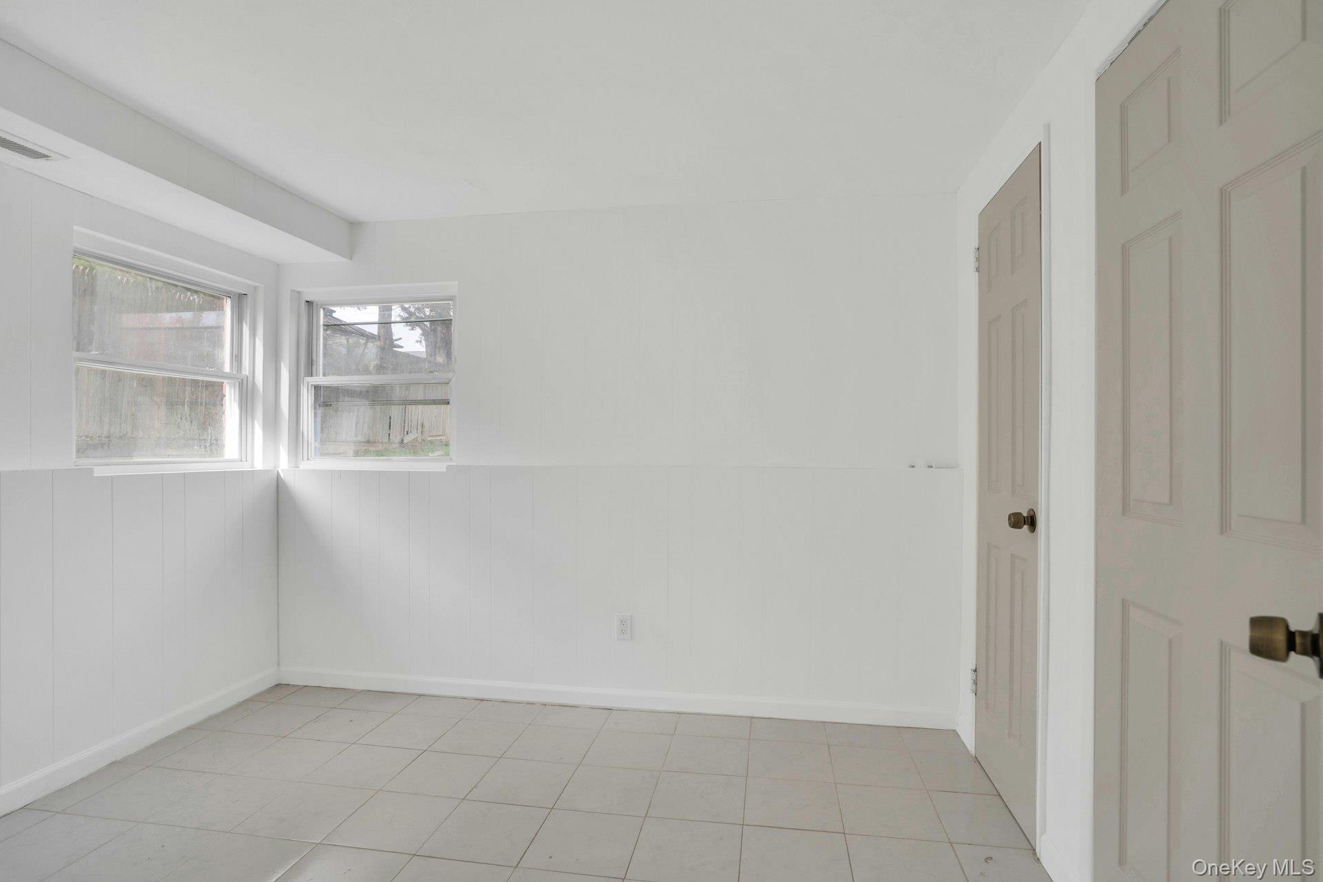 44 Delaware Avenue Commack, NY 11725 - Photo 24 of 34 a view of an empty room with a window