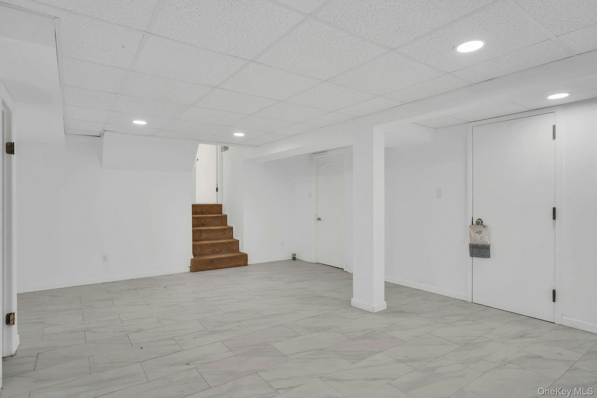 44 Delaware Avenue Commack, NY 11725 - Photo 27 of 34 a view of an empty room with wooden floor