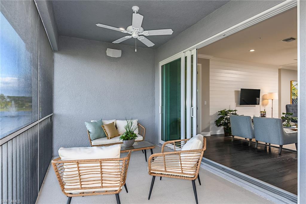 2603 Seychelles Circle, Unit 1507 Naples, FL 34112 - Photo 18 of 25 a living room with furniture and a flat screen tv