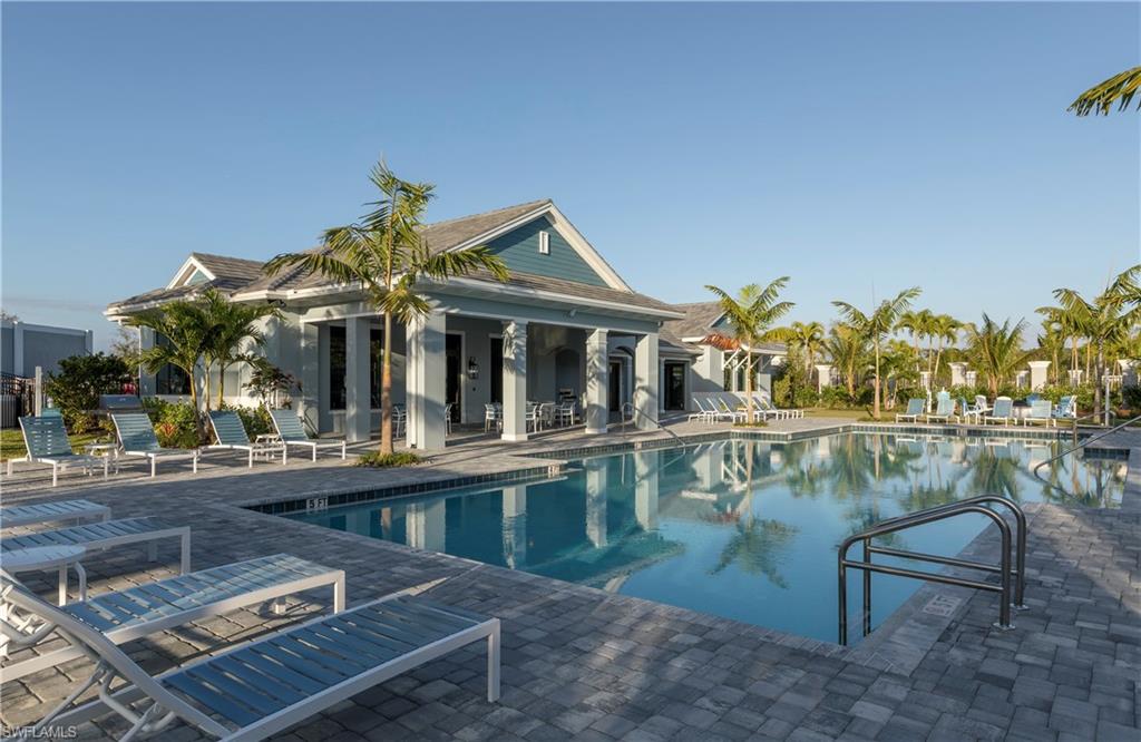 2603 Seychelles Circle, Unit 1507 Naples, FL 34112 - Photo 21 of 25 a view of a chairs and table on the terrace