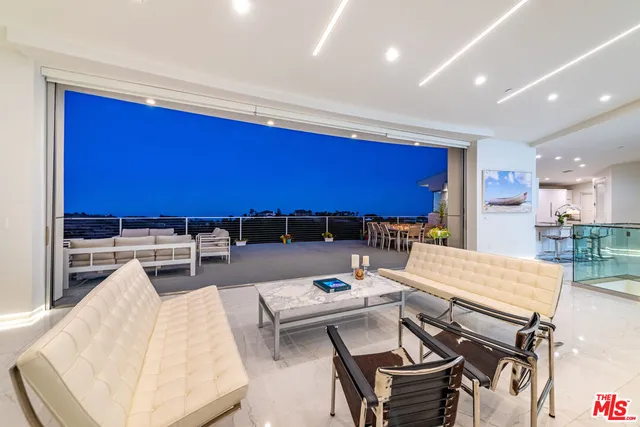 a kitchen with stainless steel appliances kitchen island granite countertop a sink and cabinets