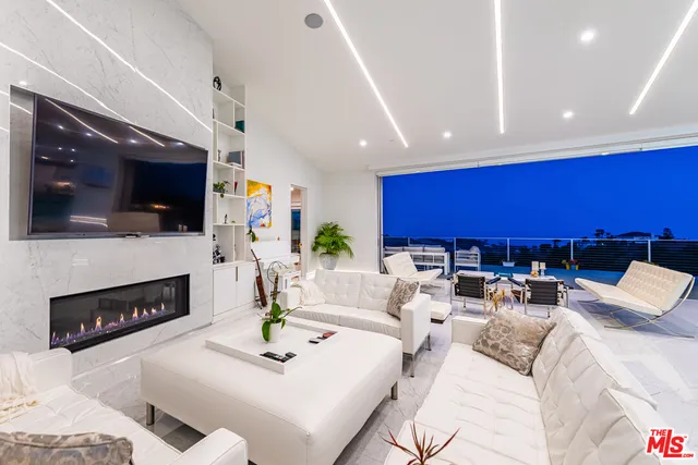 a large kitchen with a stove a sink and a refrigerator