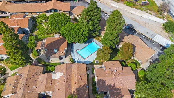 a view of a house with swimming pool and sitting area