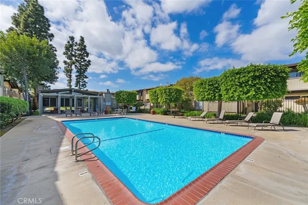 a view of a backyard with sitting area