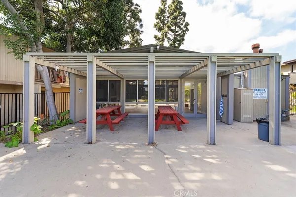 a backyard of a house with outdoor seating