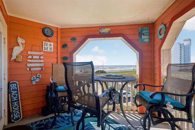 a view of an chairs and table in the balcony