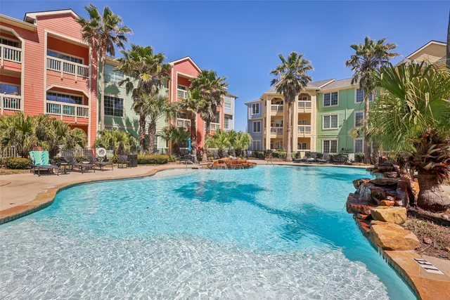 a front view of a house with yard and green space