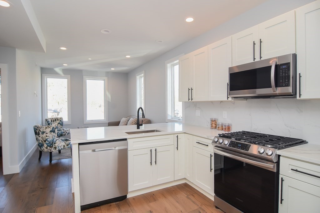 3850 Washington Street, Unit 1 Boston, MA 02131 - Photo 11 of 23 a kitchen with a sink stove and microwave