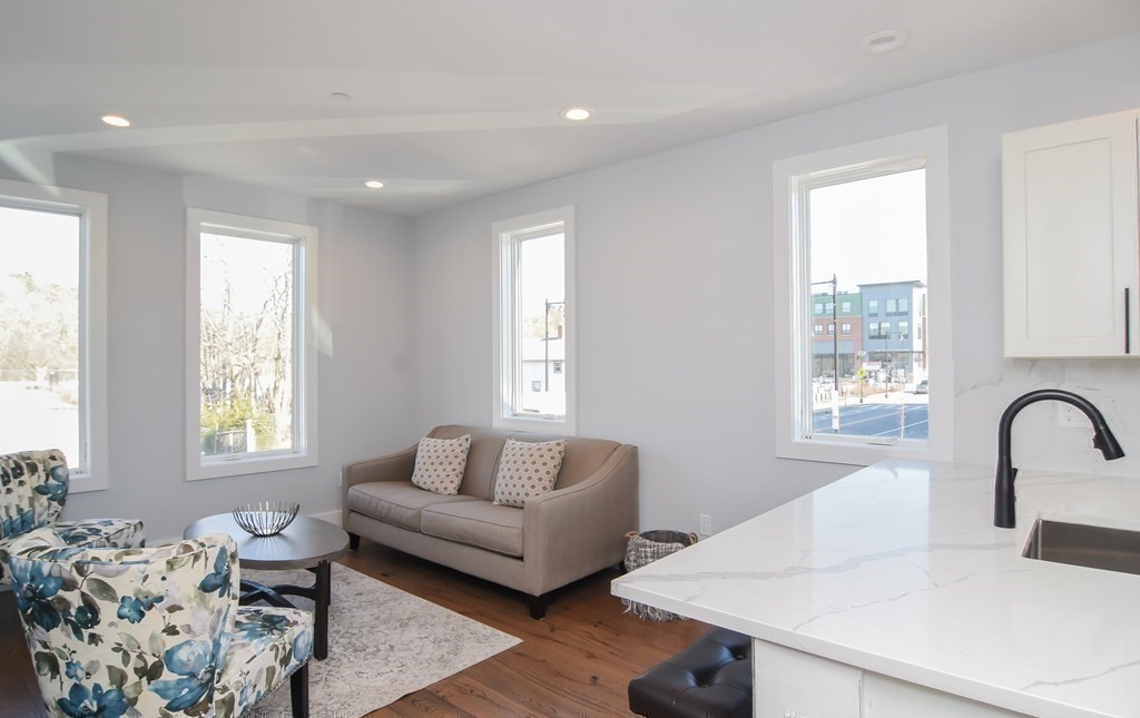 3850 Washington Street, Unit 1 Boston, MA 02131 - Photo 13 of 23 a living room with furniture and window