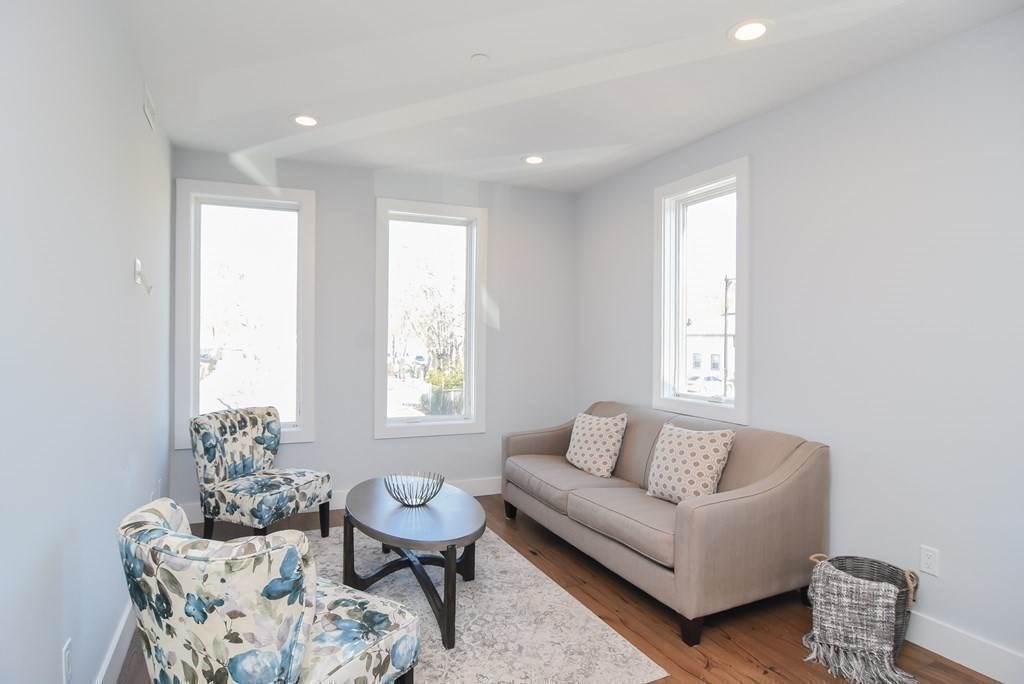 3850 Washington Street, Unit 1 Boston, MA 02131 - Photo 14 of 23 a living room with furniture and a window