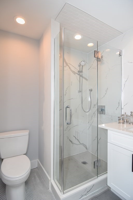 3850 Washington Street, Unit 1 Boston, MA 02131 - Photo 18 of 23 a bathroom with a shower a toilet and sink