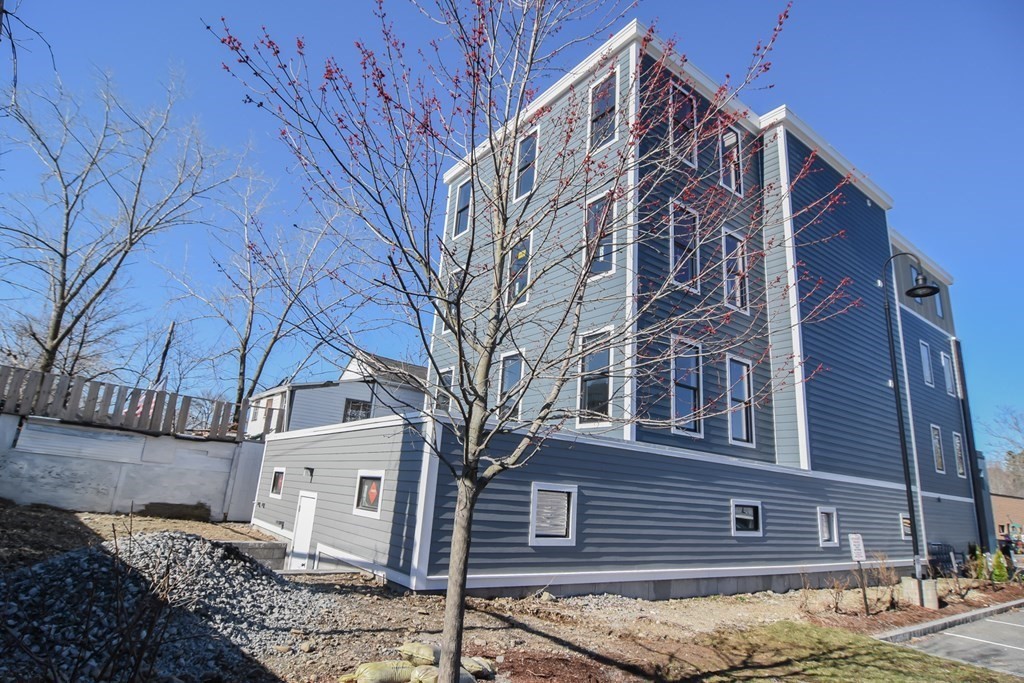3850 Washington Street, Unit 1 Boston, MA 02131 - Photo 2 of 23 a view of a house with a yard