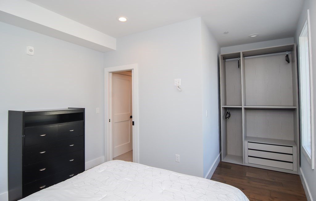 3850 Washington Street, Unit 1 Boston, MA 02131 - Photo 22 of 23 a bedroom with a bed and a dresser