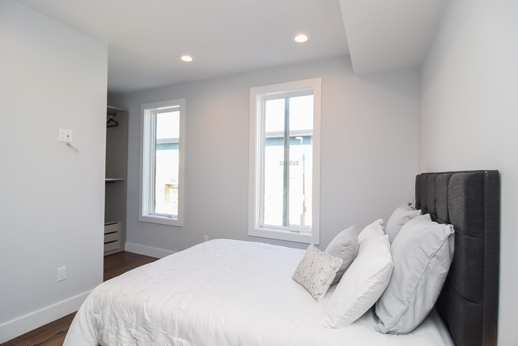 3850 Washington Street, Unit 1 Boston, MA 02131 - Photo 23 of 23 a bedroom with a bed and a window