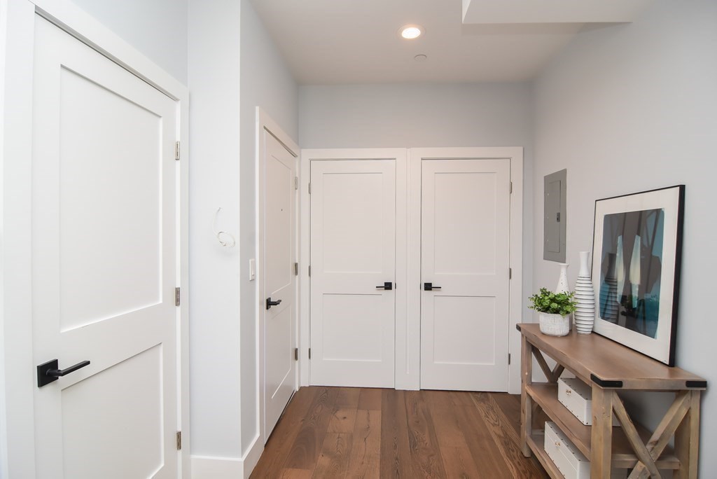 3850 Washington Street, Unit 1 Boston, MA 02131 - Photo 6 of 23 a view of a hallway with wooden floor and entryway