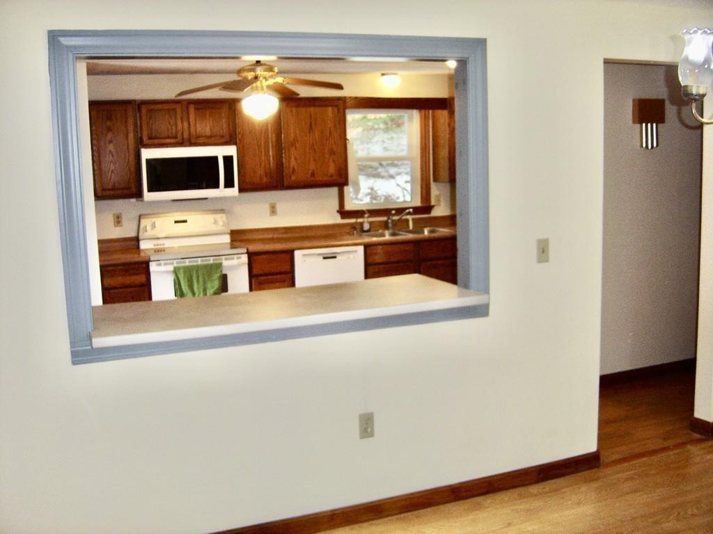 137 Eli Drive Winchendon, MA 01475 - Photo 9 of 38 a kitchen with stainless steel appliances a microwave and a refrigerator