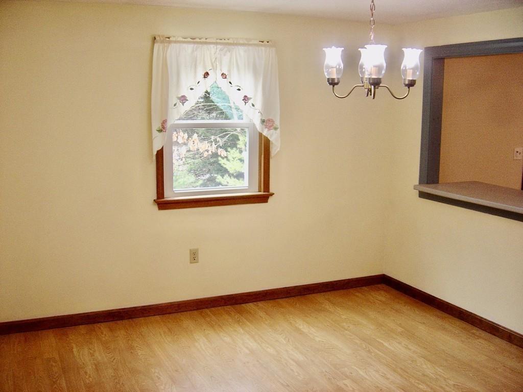 137 Eli Drive Winchendon, MA 01475 - Photo 10 of 38 a view of empty room with wooden floor and window