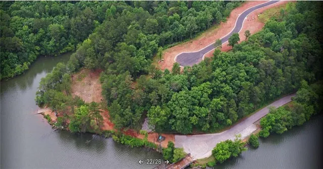 a backyard of a house with lots of tall trees