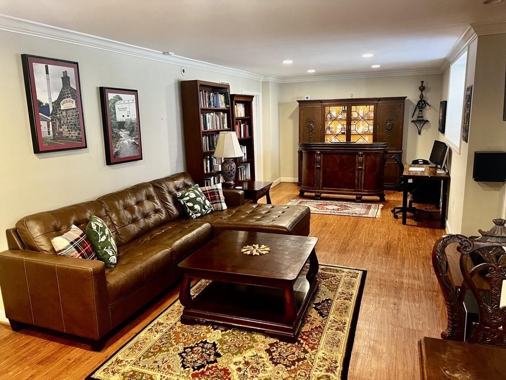 a living room with furniture fireplace and a flat screen tv