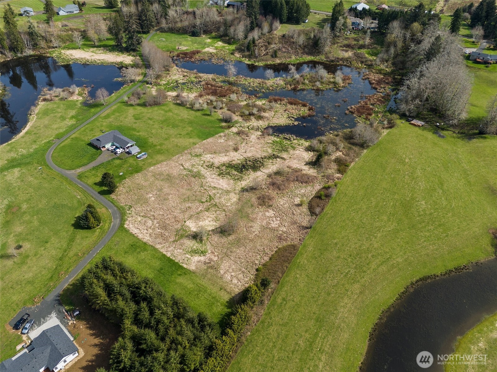 0 X Lilly Wheaton Road Raymond, WA 98577 - Photo 10 of 14 a view of a lake with a yard