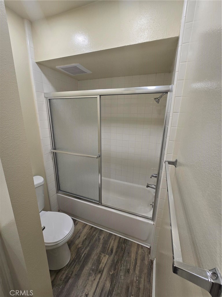 220 12th Street, Unit 8 Huntington Beach, CA 92648 - Photo 9 of 10 a bathroom with a toilet and a shower