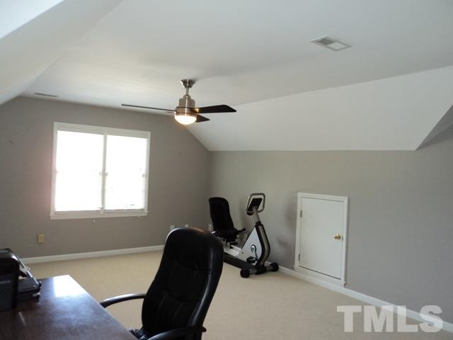 6900 Wilderness Road Raleigh, NC 27613 - Photo 18 of 25 a view of a workspace with furniture and a window