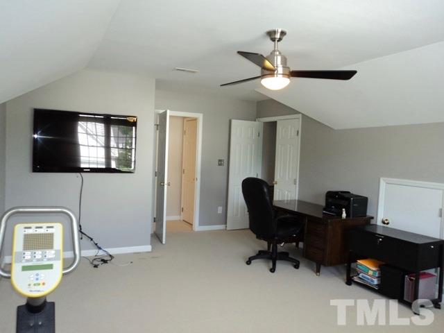 6900 Wilderness Road Raleigh, NC 27613 - Photo 19 of 25 a view of a workspace with furniture and a window