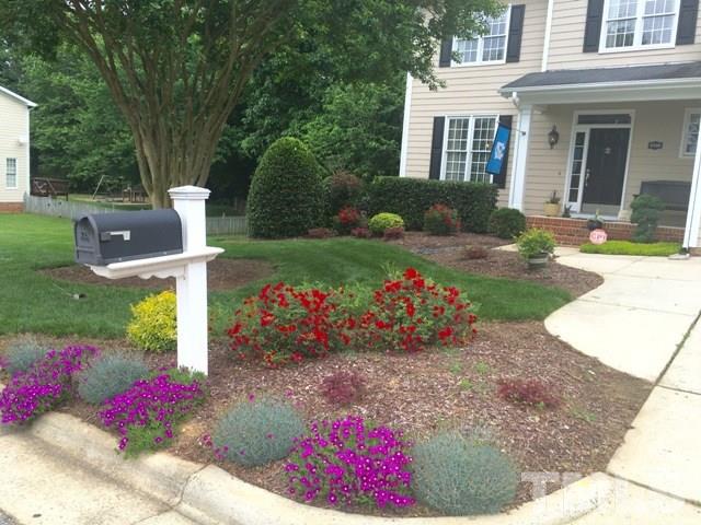 6900 Wilderness Road Raleigh, NC 27613 - Photo 20 of 25 front view of a house and a yard