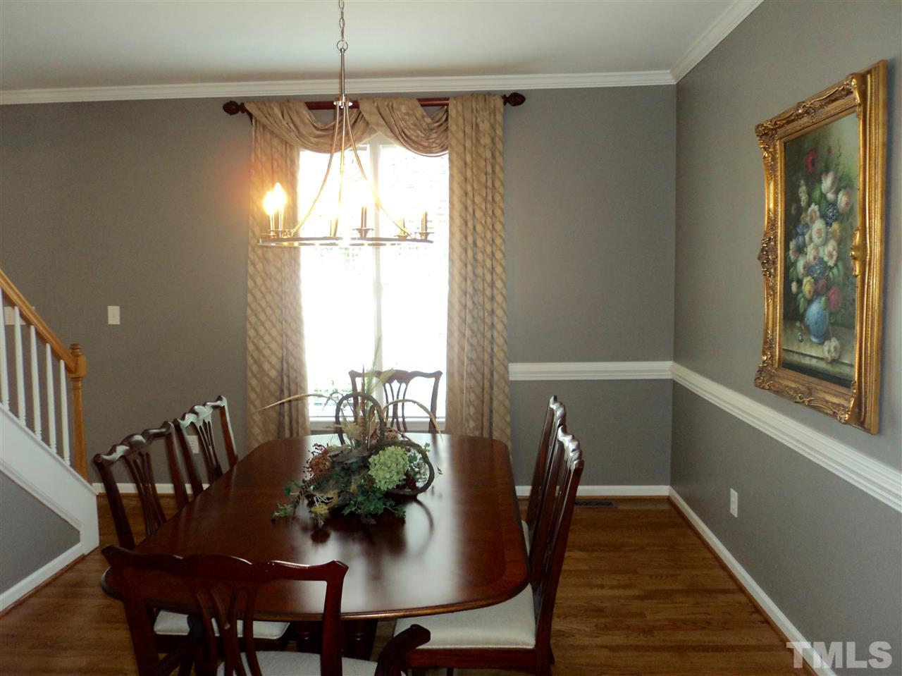 6900 Wilderness Road Raleigh, NC 27613 - Photo 3 of 25 a view of a dining room with furniture window and wooden floor